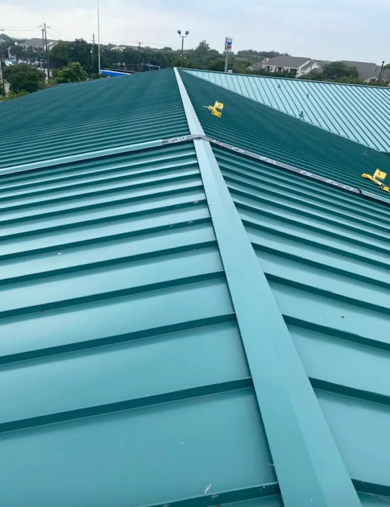 Green commercial metal roof ridge and valley for Metal Roof Repair in Ledyard